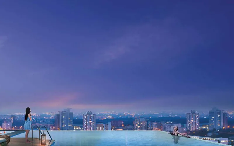 Purva Orient Grand: Rooftop infinity pool at dusk